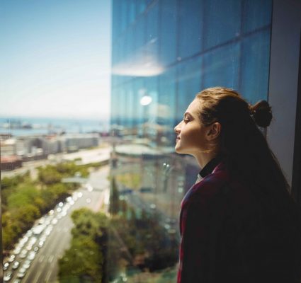 Femalegraphicdesignerlookingthroughwindow-2048x1365
